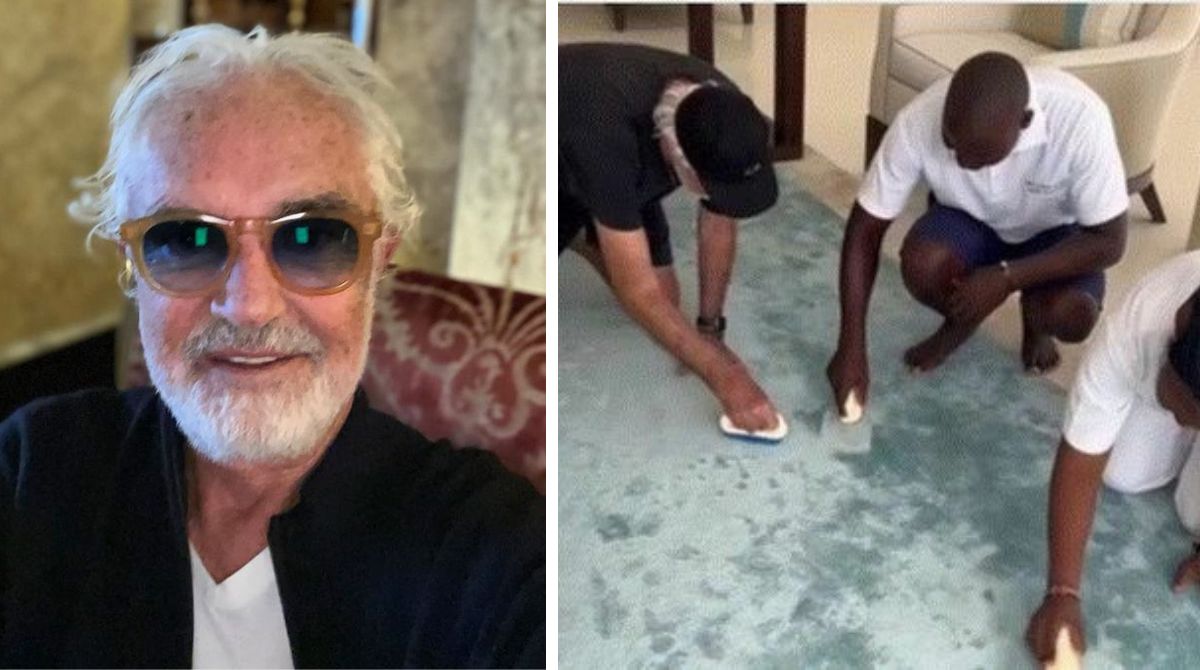 Flavio Briatore si inginocchia e pulisce il tappeto con i dipendenti: l’ironia corre sui social